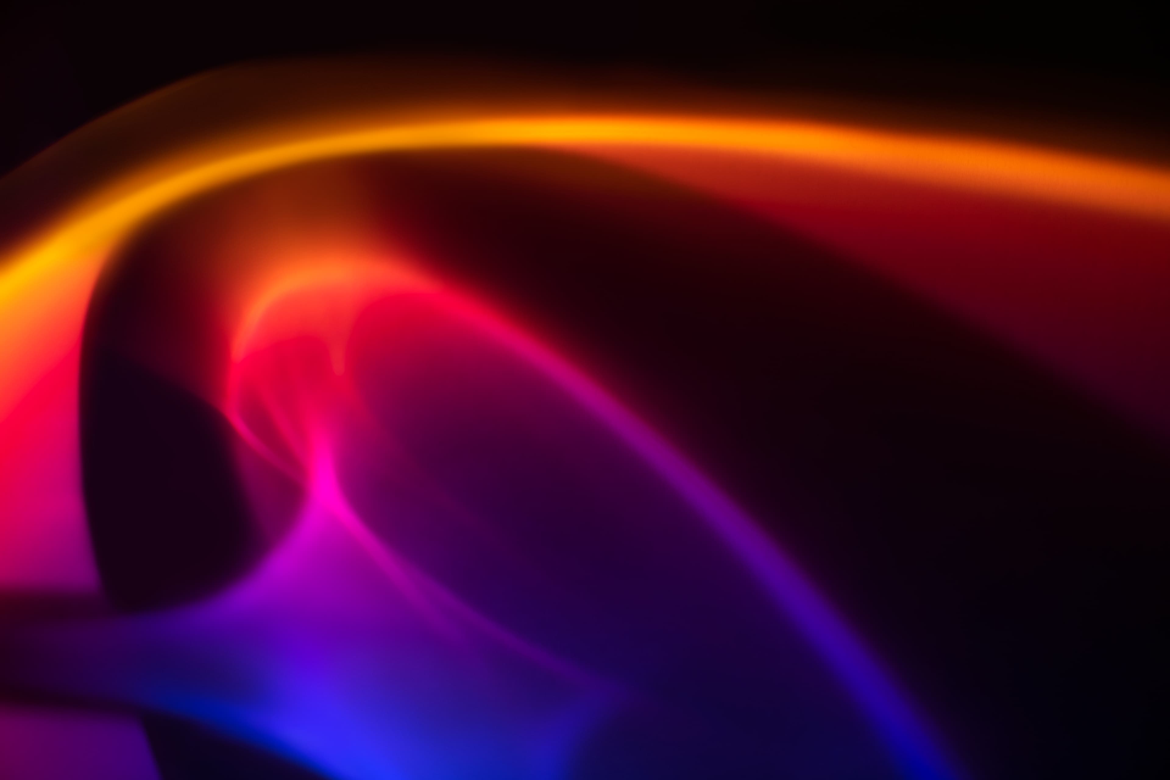 Abstract neon background with orange and violet liquid light